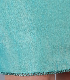 Turquoise skirt in linen and viscose fabric with garnish