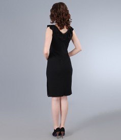 Jersey dress with furbelow and trim