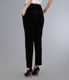 Elastic velvet trousers with pockets