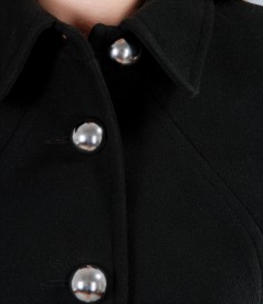 Black coat with applied pockets