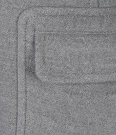 Grey coat with applied pockets