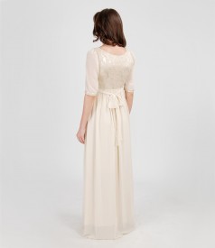 Long evening dress from elastic brocade and veil