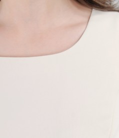 Elegant cream dress with lacquer contrast trim