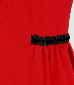 Elastic fabric dress with folds and velvet trim