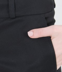 Elastic cotton trousers with pockets