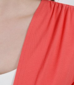 Coral red jersey blouse tied with cord