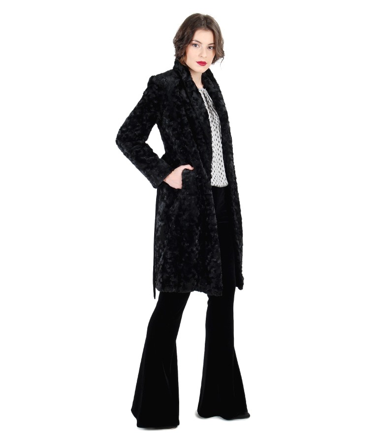 Fur coat and velvet flared pants