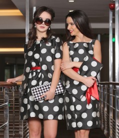 Flaring dress with dots and red belt