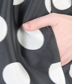 Flaring dress with dots and red belt