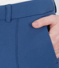 Elastic fabric pants with faux leather trim