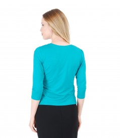 Turquoise jersey blouse tied with cord