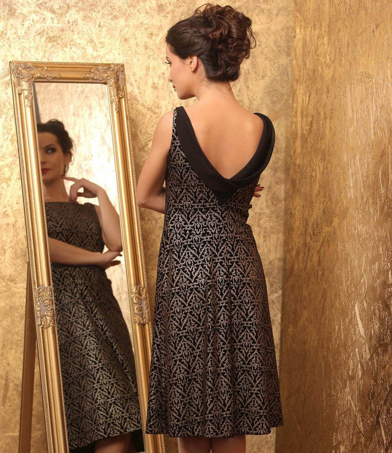 Evening dress made of elastic velvet printed with golden motifs