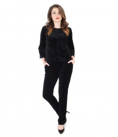 Elegant outfit with jacket and black velvet pants