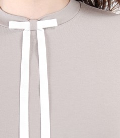 Elegant blouse with bow on decolletage