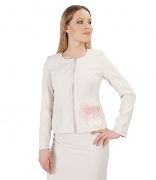 Cream jacket with accessory brooch