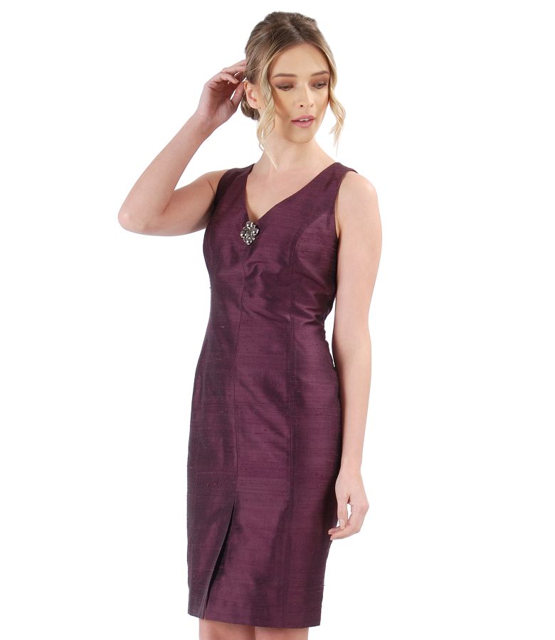 Taffeta dress with accessory brooch on decolletage