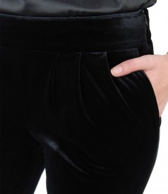 Elastic velvet trousers with pockets