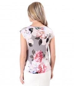 Elastic jersey blouse printed with floral motifs