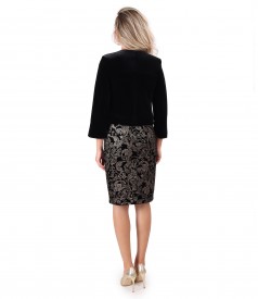 Elegant outfit with velvet dress printed with gold motifs and black velvet bolero