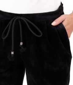 Elastic velvet pants with cuffs at the end