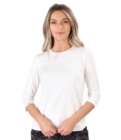 Elastic jersey blouse with rips at the decolletage and sleeve