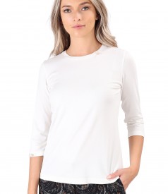 Elastic jersey blouse with rips at the decolletage and sleeve