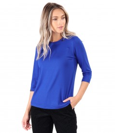 Elastic jersey blouse with rips at the decolletage and sleeve