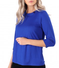 Elastic jersey blouse with rips at the decolletage and sleeve