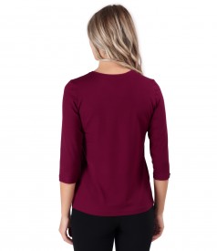 Elastic jersey blouse with rips at the decolletage and sleeve