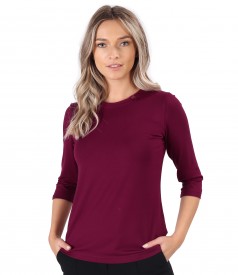 Elastic jersey blouse with rips at the decolletage and sleeve