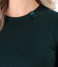 Elastic jersey blouse with rips at the decolletage and sleeve