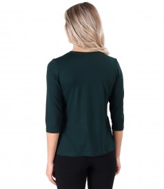 Elastic jersey blouse with rips at the decolletage and sleeve