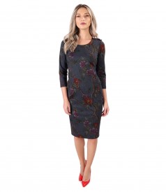 Dress made of thick elastic jersey with floral trimmings on the shoulder