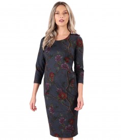 Dress made of thick elastic jersey with floral trimmings on the shoulder