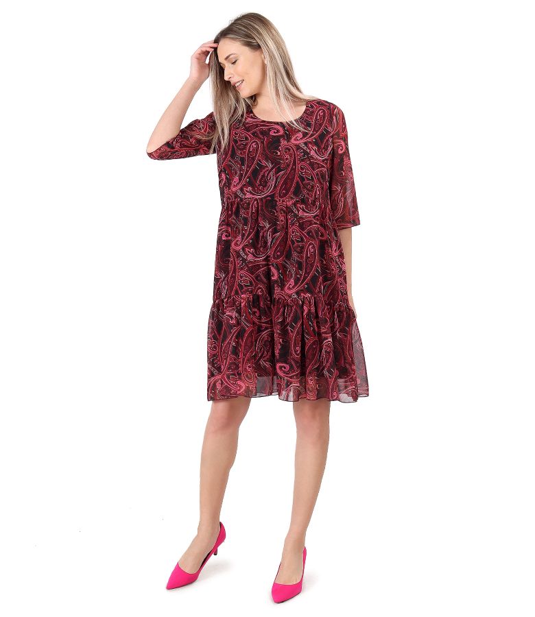 Dress with ruffles made of printed veil with paisley motifs