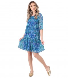 Dress with ruffles made of printed veil with floral motifs