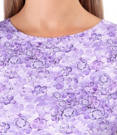 Elastic jersey blouse printed with floral motifs