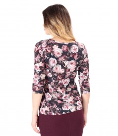 Elastic jersey blouse printed with floral motifs