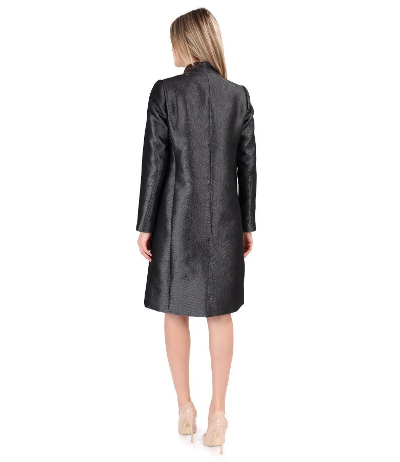 Elegant outfit with glossy fabric overcoat and flared dress