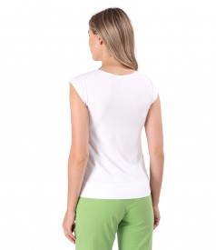 Elastic jersey blouse with decorative element on the shoulder