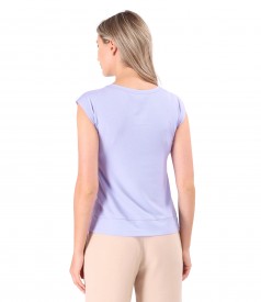 Elastic jersey blouse with decorative element on the shoulder