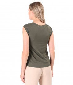 Elastic jersey blouse with decorative element on the shoulder