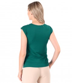 Elastic jersey blouse with decorative element on the shoulder