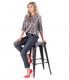 Elegant outfit with printed natural silk blouse and elastic denim pants