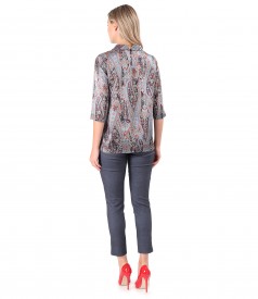 Elegant outfit with printed natural silk blouse and elastic denim pants