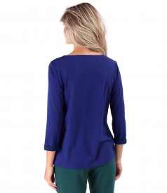 Elastic jersey blouse with decorative chain on the front