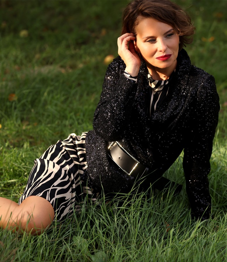 Elegant outfit with sequin jacket and viscose dress with animal print
