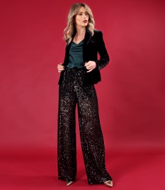 Elegant outfit with sequin pants and velvet jacket