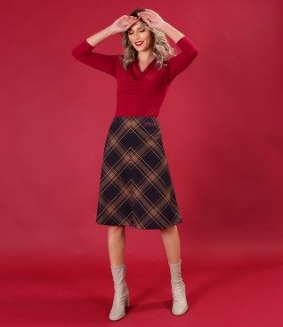 Elegant outfit with flared checked skirt and jersey blouse