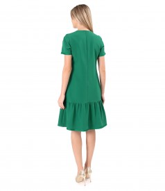 Elegant dress with a ruffle and satin ribbon at the end